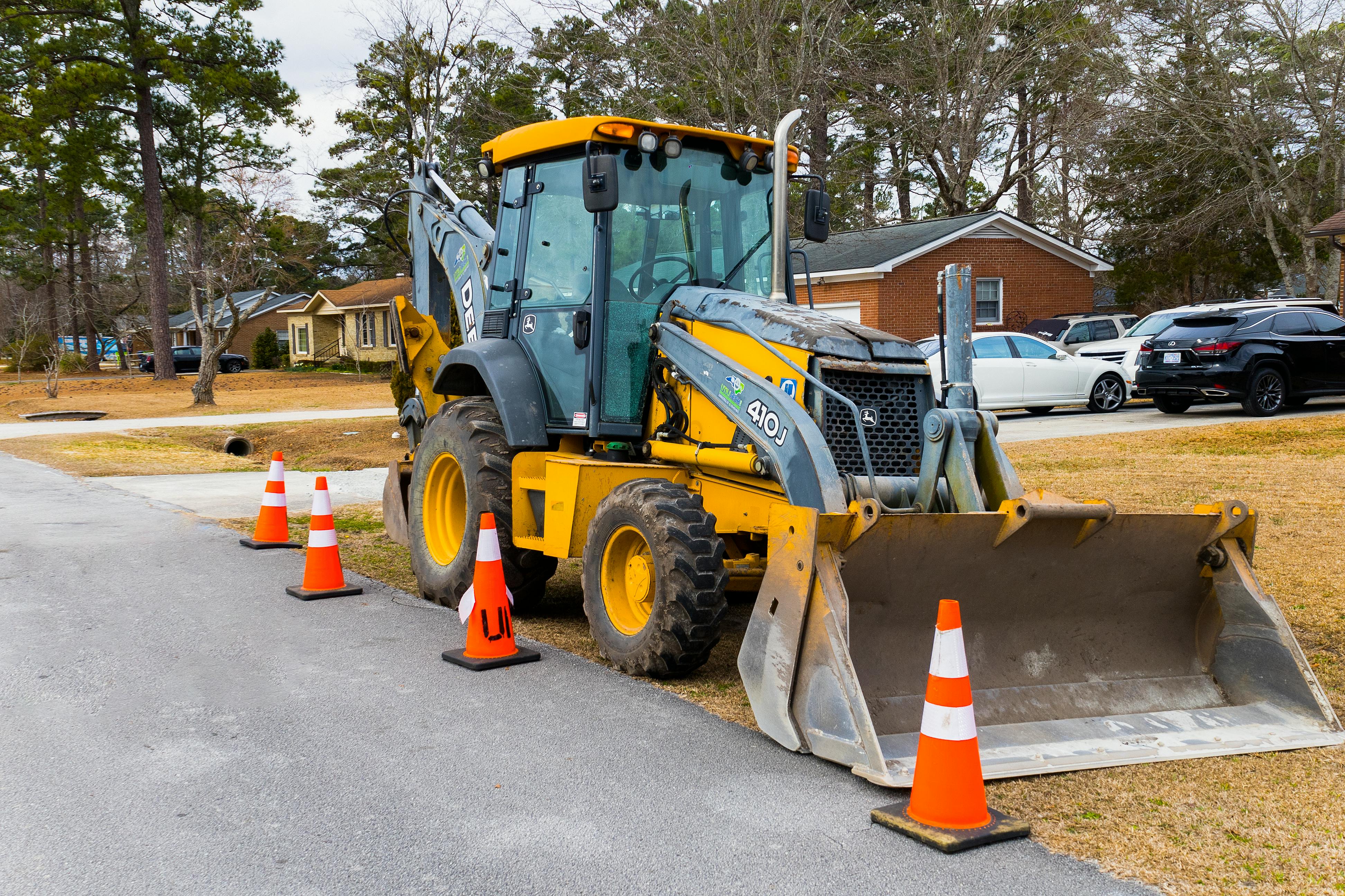Residential excavation equipment working carefully on a Metro Detroit homeowner's property